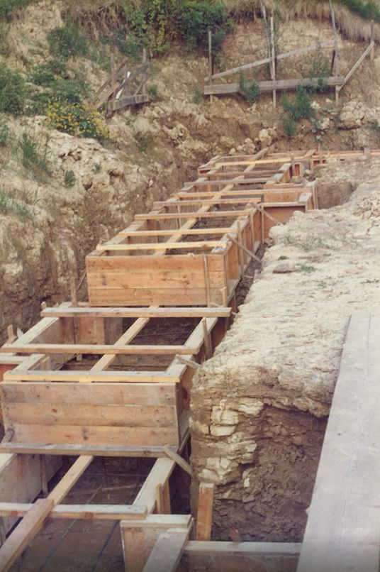 Stepped timber footing forms in excavation trench with rebar